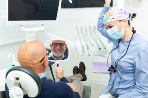 Man looking in mirror after oral surgery